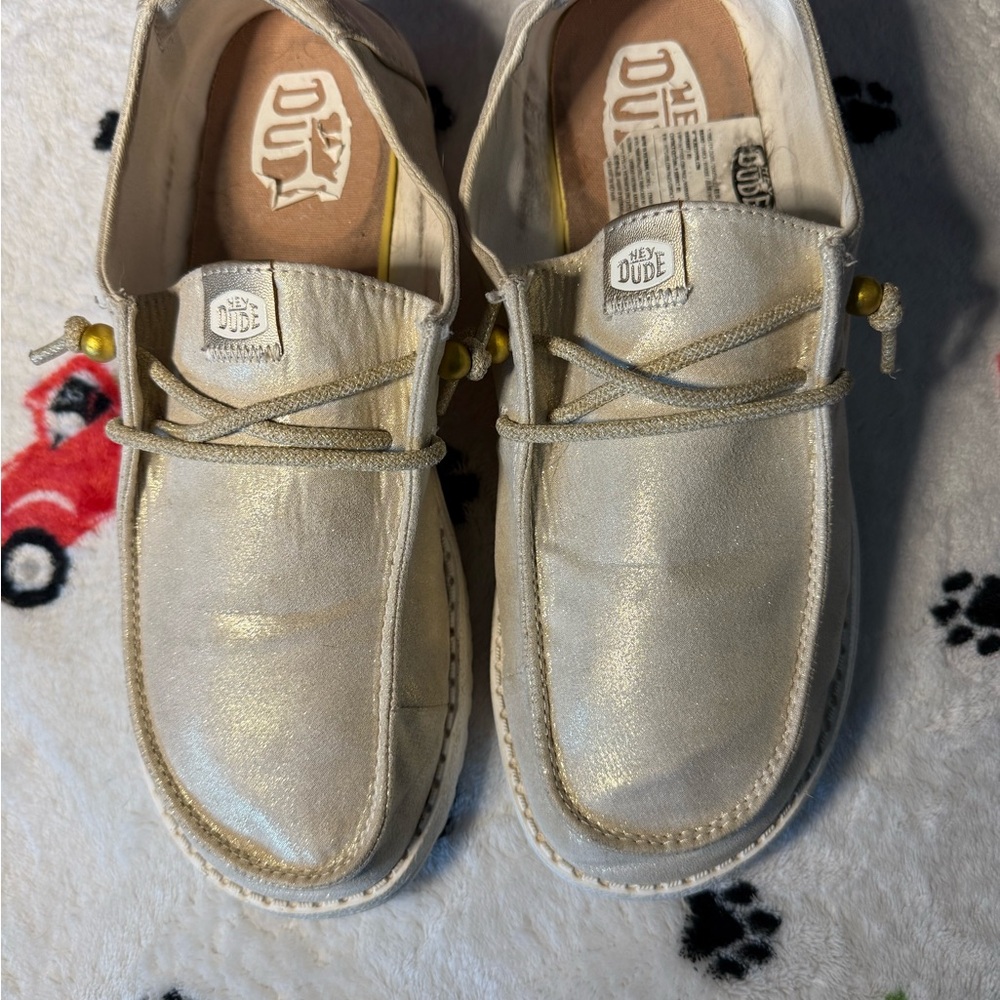 Hey Dude Women’s Shimmering gold slip-on shoes